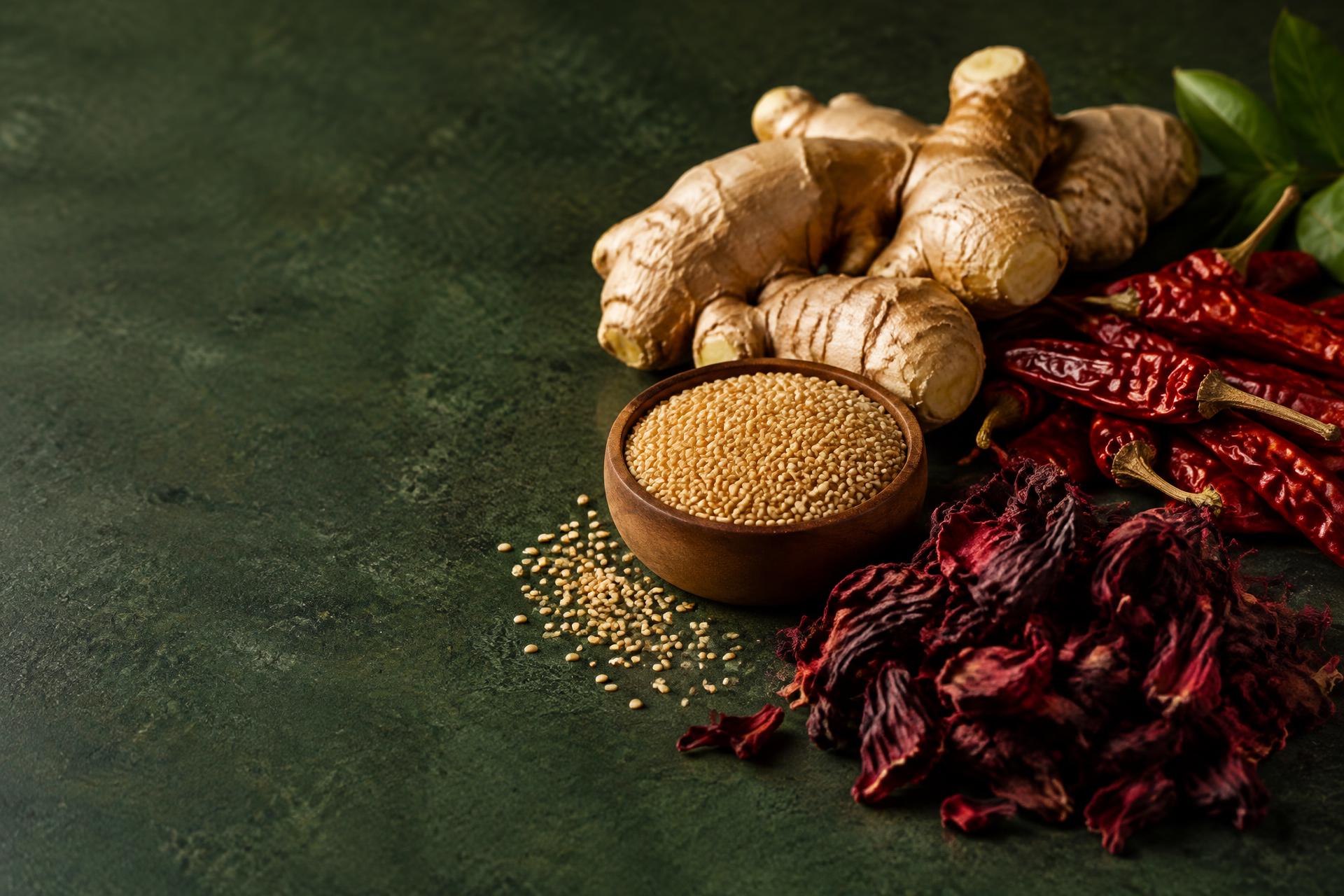 Nigerian agricultural produce including ginger, sesame seeds, dried peppers and hibiscus flowers — illustrative image